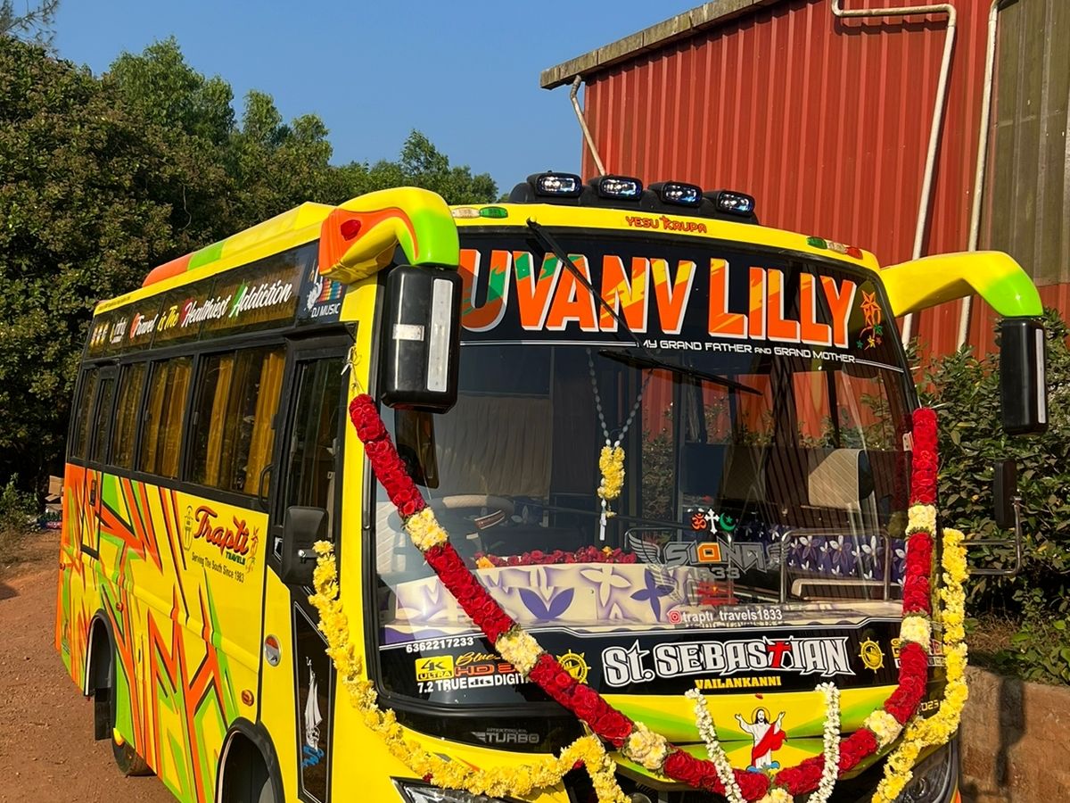 Trapti Travels mini bus, garlanded, at Honnavar