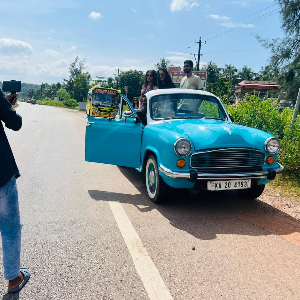 Garlanded mini bus on a blue-sky morning