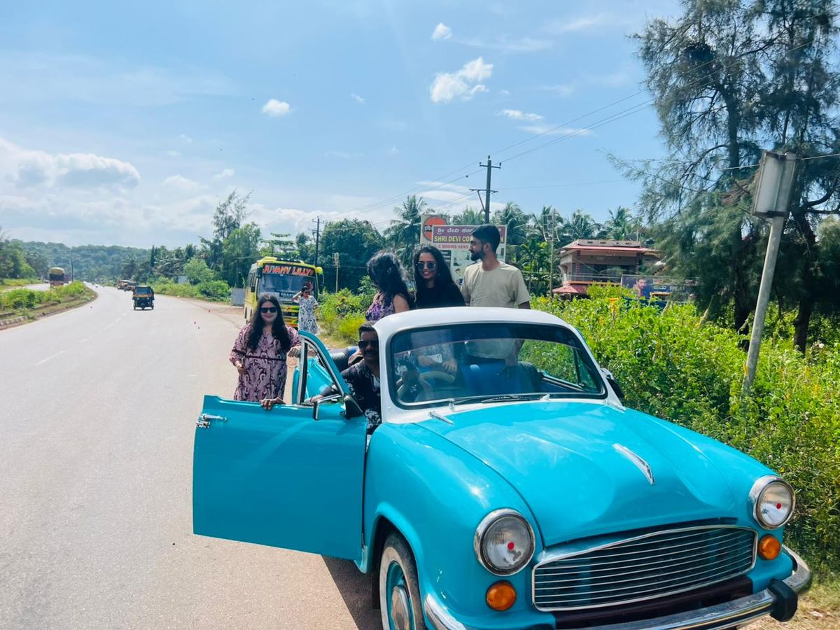 Sky blue open-top Hindustan Ambassador